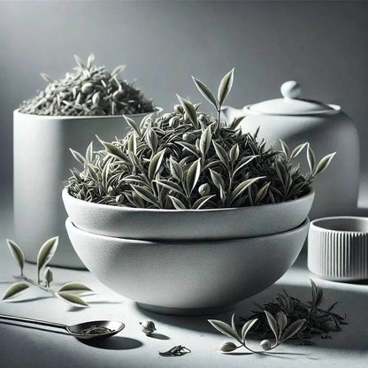 Vietnam Mao Feng white tea leaves in a ceramic bowl.
